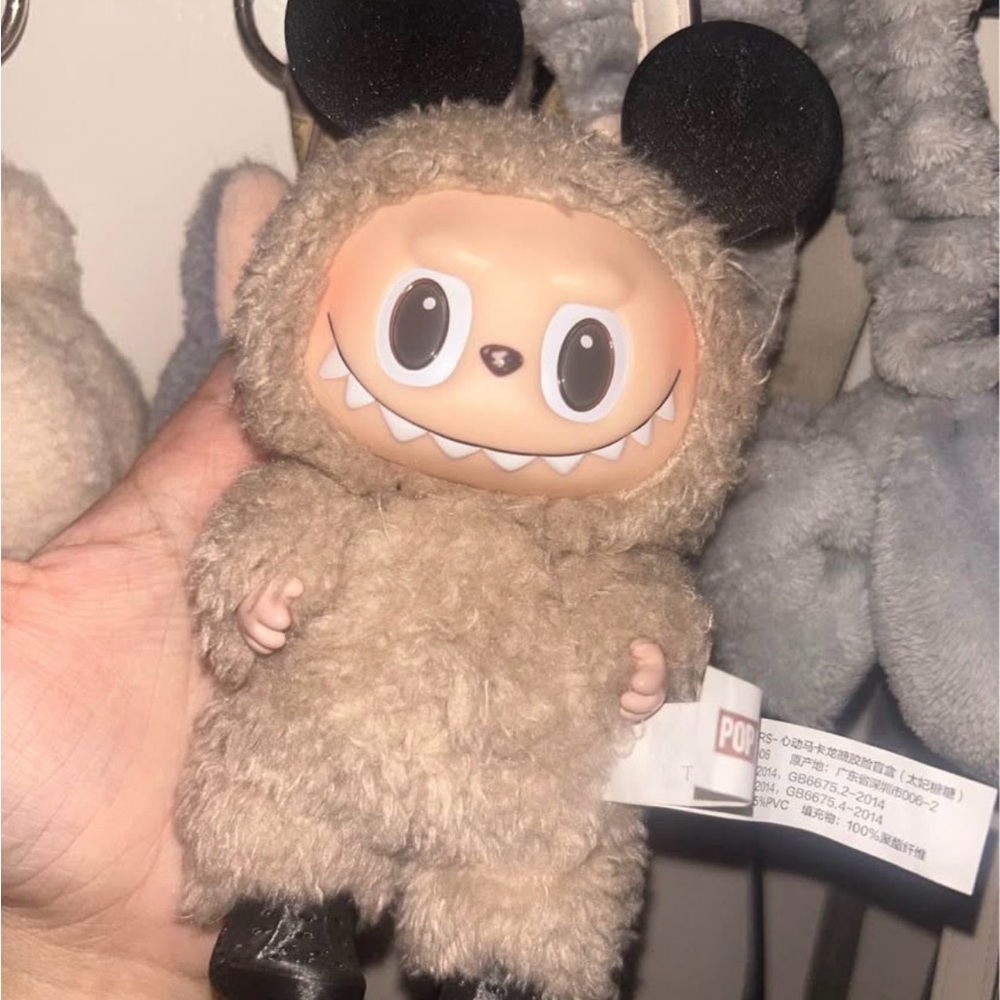 Adorable Tan Stuffed Animal with Black Ears